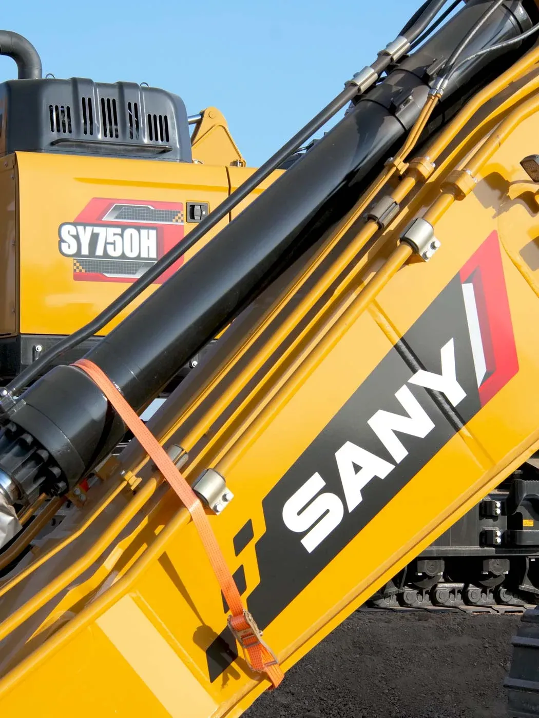 The boom and stick of a SANY SY750H excavator secured for transport.